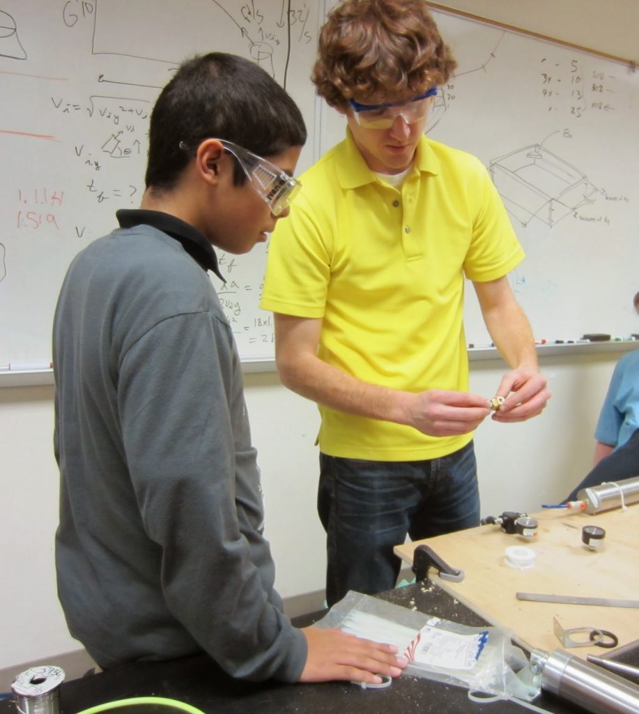 Student Ivan G. learning about pneumatics