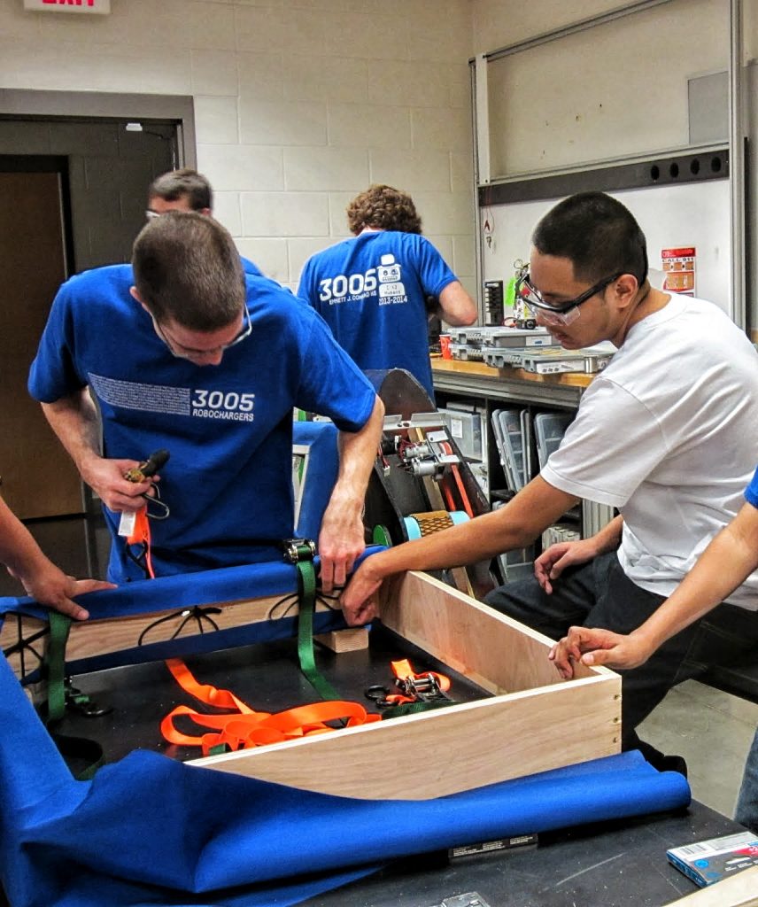 Mentor Jarrod Krebs and student Joel G. build one purrty bumper